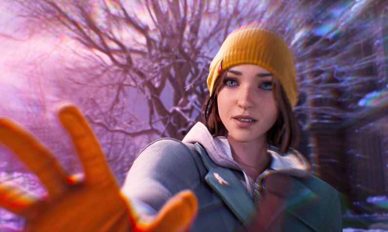 Junge Frau mit gelber Mütze und oranger Handschuh streckt Hand aus, winterlicher Hintergrund mit verschneiten Bäumen | © Square Enix / Deck Nine Games