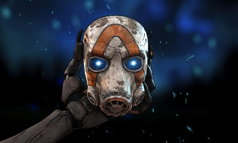 Pressebild zu Borderlands 4: Eine Roboterhand hält eine abgenutzte Gasmaske mit leuchtenden blauen Augen vor einem dunklen, unscharfen Hintergrund. | © Take Two